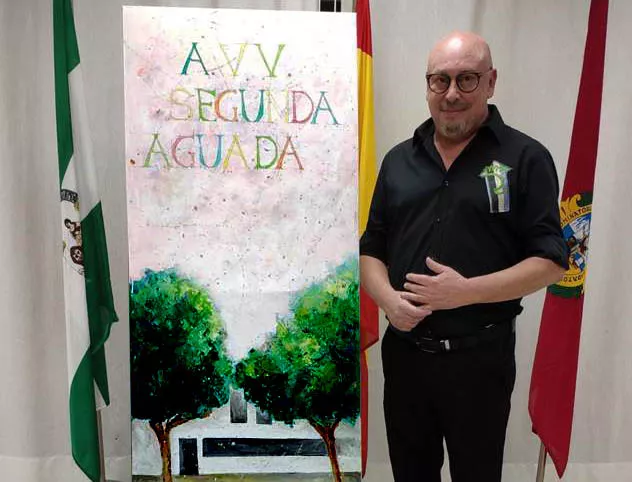 Guillermo Márquez Puyana con el cartel noticias cadiz AVV segunda aguada.jpg